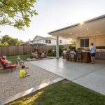 Exposed aggregate concrete patio slab in Logan backyard with outdoor entertaining area
